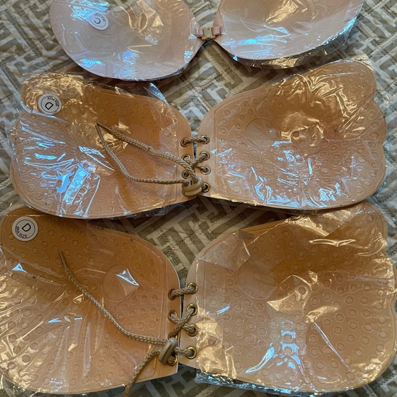 Nude/tan in color. Backless, strapless push up bras with silicone. - Picture 2 of 4